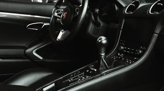 Clean black leather interior, steering wheel and centre console